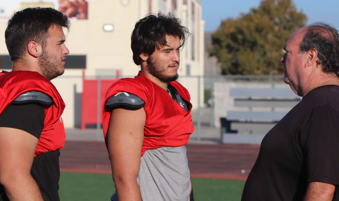 Brent and Wade Hlton with line coach Alan Kreuger.
